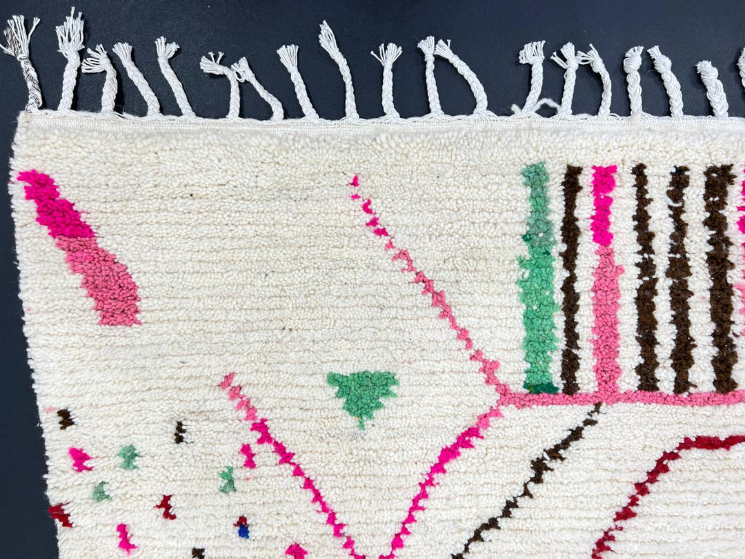 Handwoven colorful Moroccan wool runner rug with pink, green, and blue geometric Berber patterns
