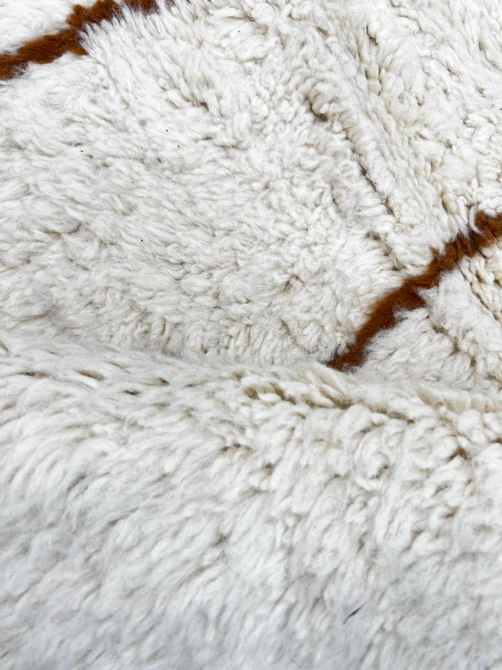 Handmade Moroccan wool runner rug with white background and brown Berber diamond pattern, plush texture, fringed edges – modern boho Moroccan carpet for hallway and corridor decor