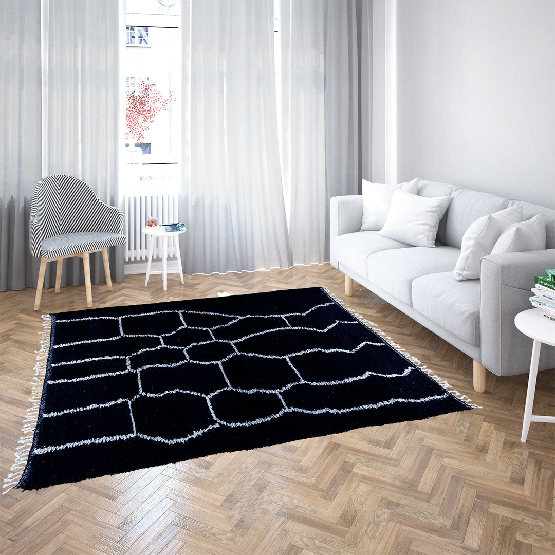 Solid black Moroccan rug with hand-knotted white tribal lines