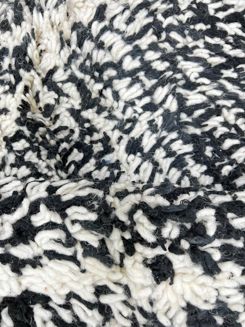 Round black and white Moroccan rug with modern diamond pattern, handmade wool Berber carpet