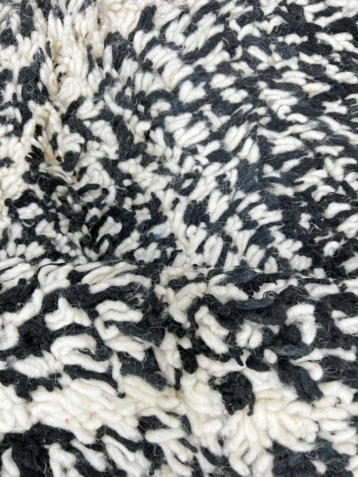 Round black and white Moroccan rug with modern diamond pattern, handmade wool Berber carpet