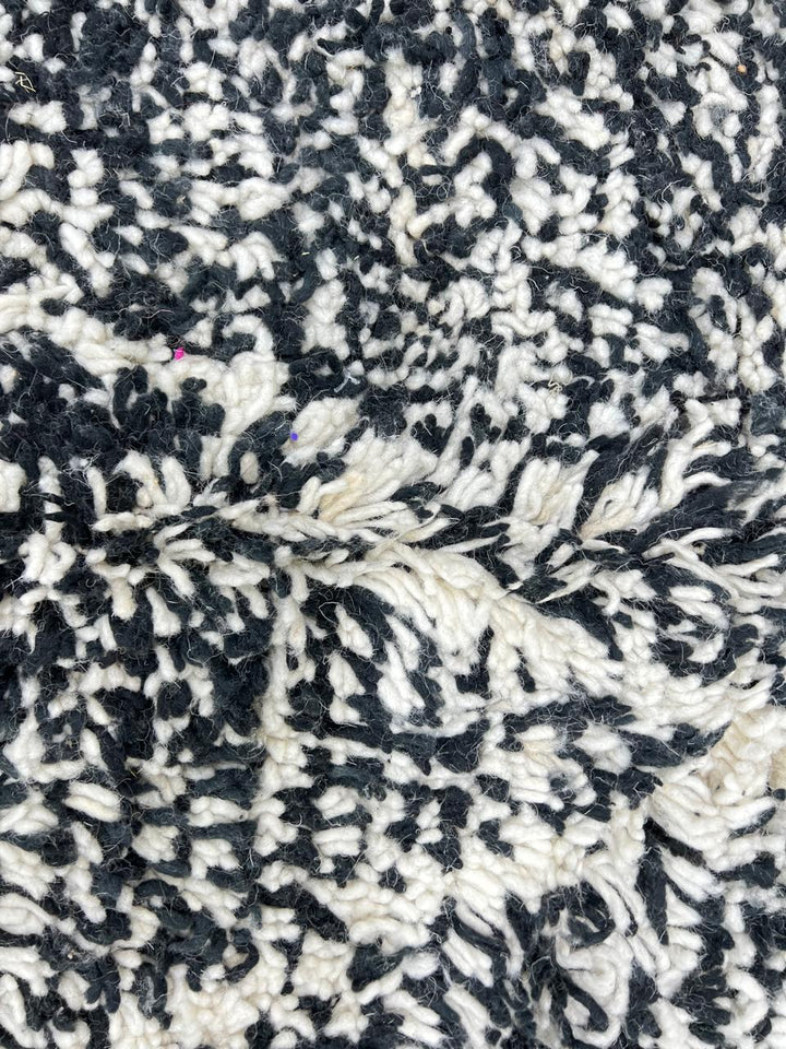 Round black and white Moroccan rug with modern diamond pattern, handmade wool Berber carpet