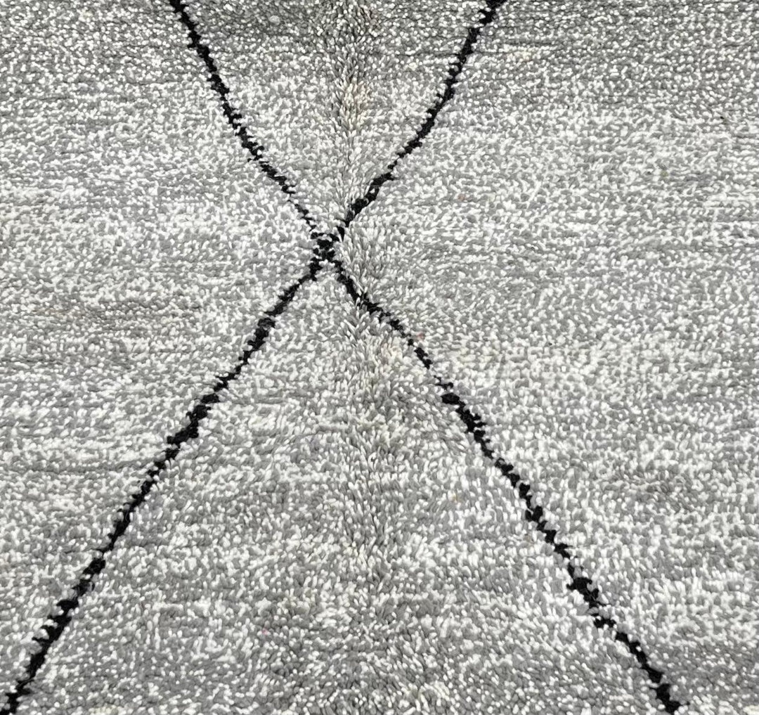Round grey Moroccan wool rug with minimalist black diamond Beni Ourain lines handmade by Berber artisans