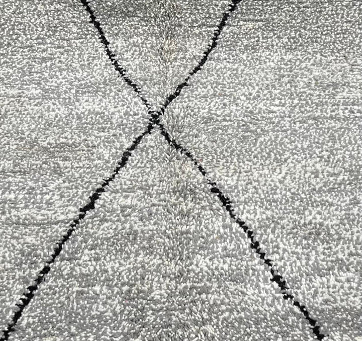 Round grey Moroccan wool rug with minimalist black diamond Beni Ourain lines handmade by Berber artisans