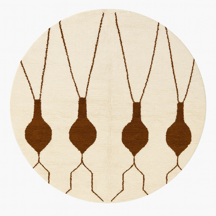 Round Moroccan Berber rug with white wool base and brown hanging geometric motifs, handmade wool carpet