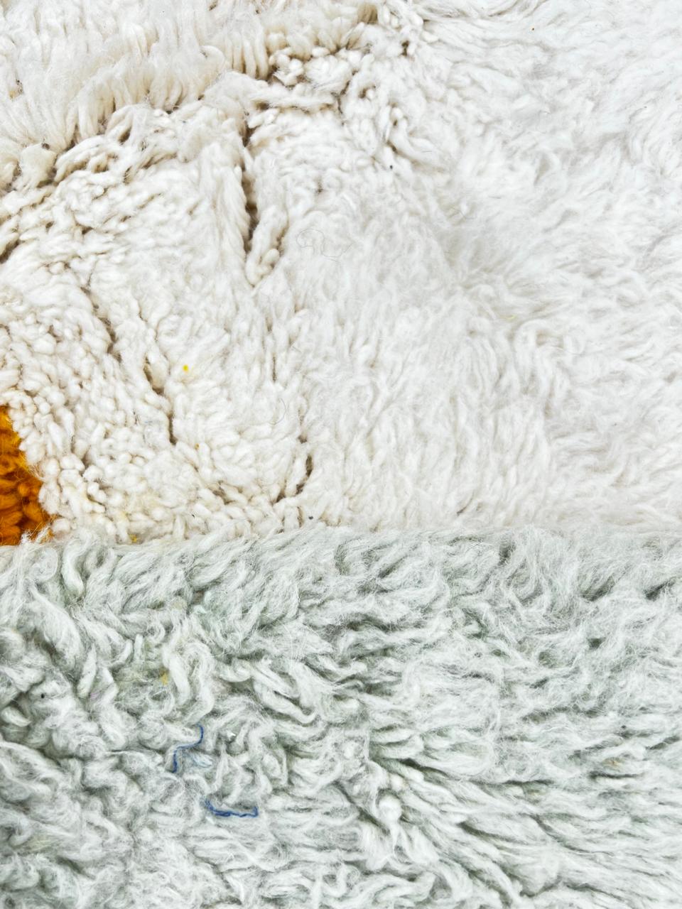 Round colorful Moroccan wool rug with modern abstract design