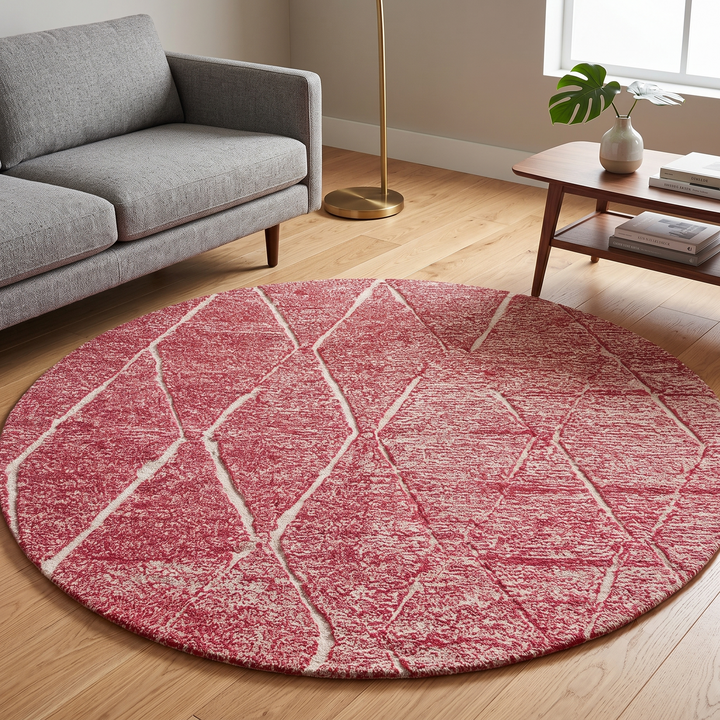 Round pink Moroccan wool rug with white Beni Ourain diamond pattern, handmade by Berber artisans
