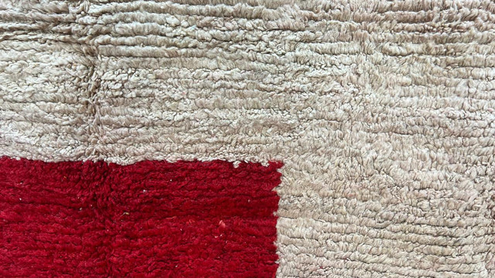 Handmade round Moroccan wool rug with modern geometric Berber design and plush handwoven texture.