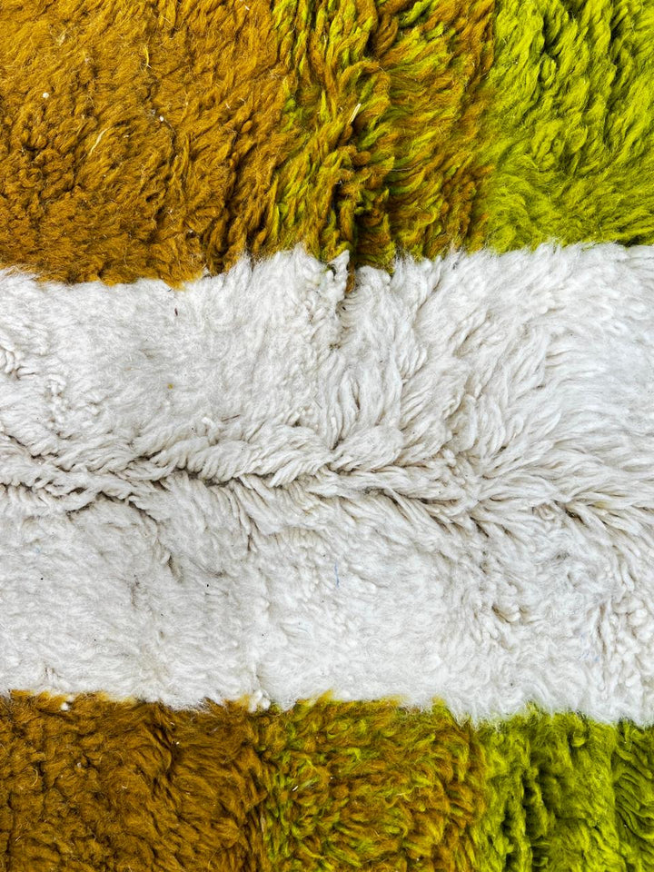 Round white Moroccan wool rug with modern abstract multicolor design