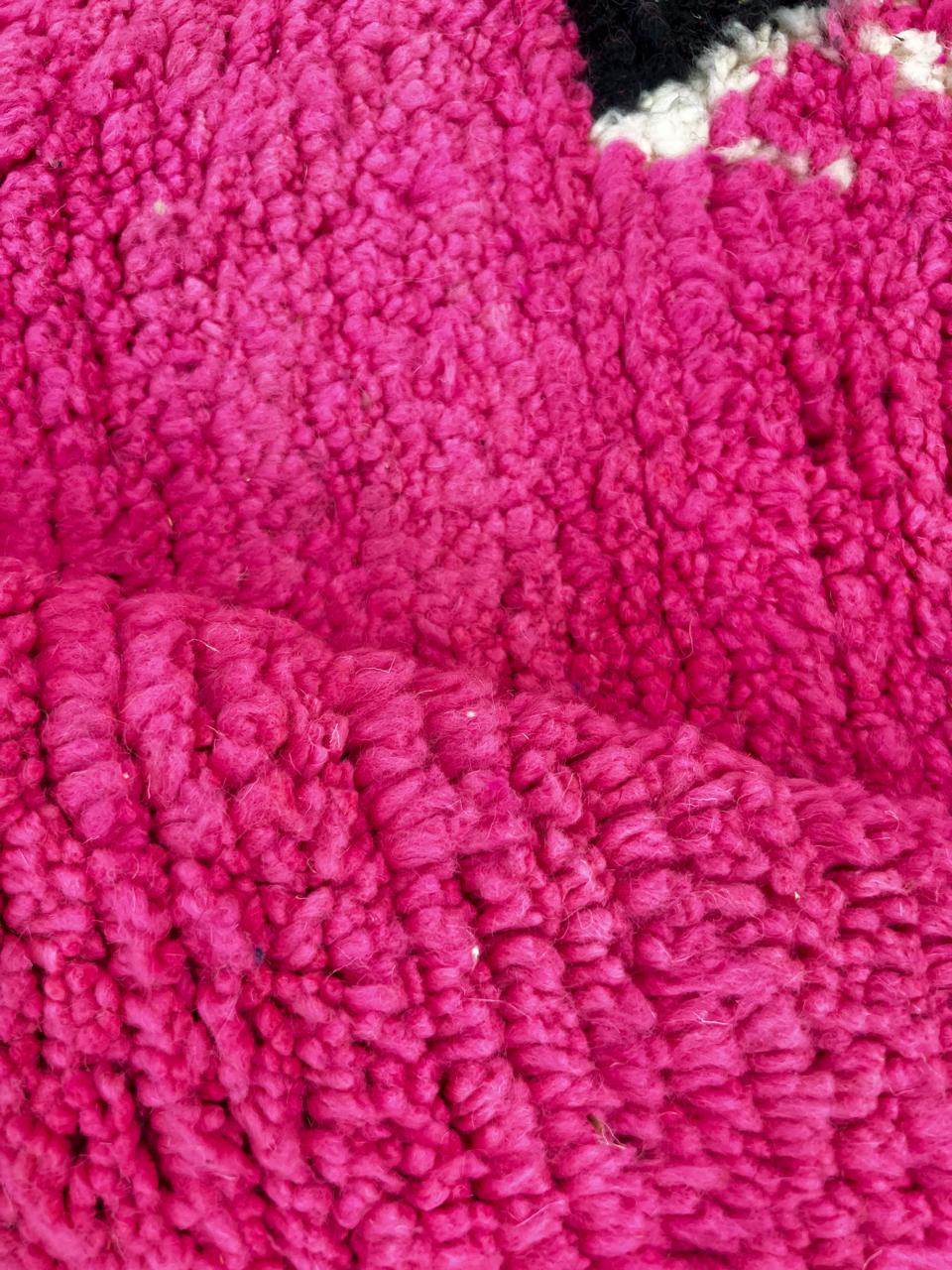 Handmade vibrant pink Moroccan wool runner rug with colorful tribal Berber motifs