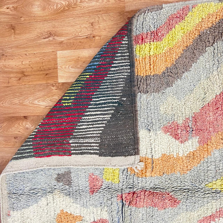 Vintage Moroccan wool rug with abstract Berber pattern in earthy tones, handmade in Morocco