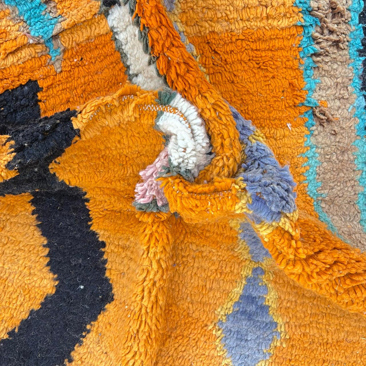 Vintage Moroccan wool rug in orange tones with abstract Berber geometric patterns, handmade in Morocco