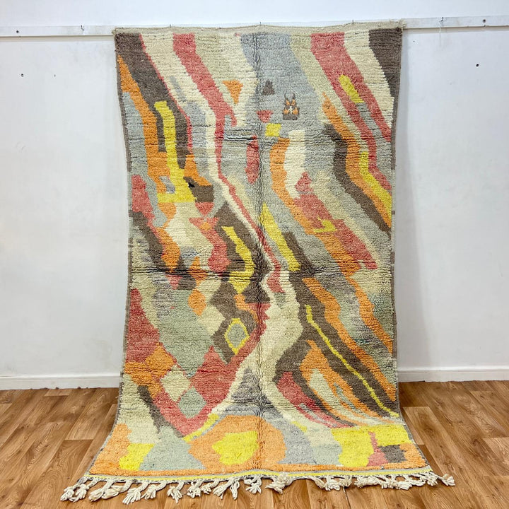 Vintage Moroccan wool rug with abstract Berber pattern in earthy tones, handmade in Morocco