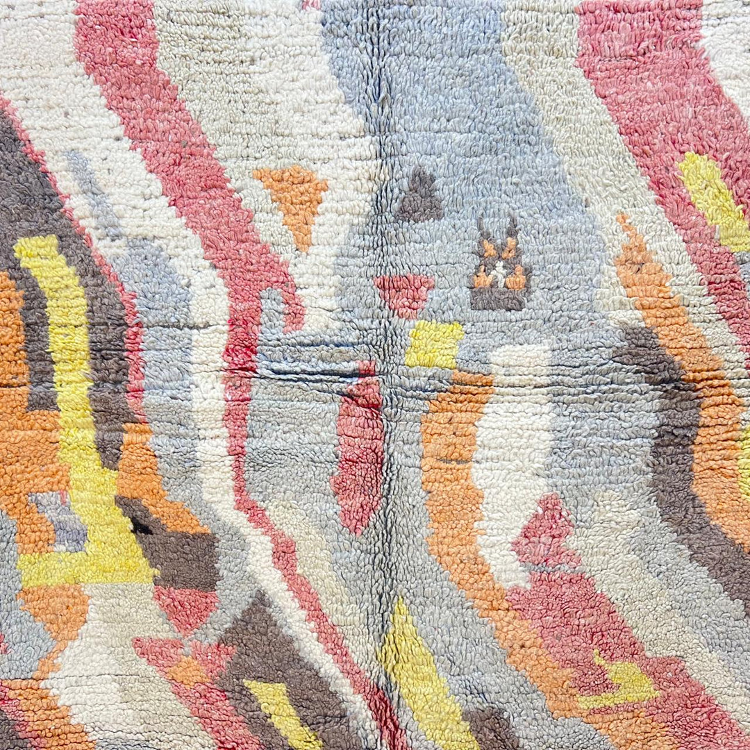 Vintage Moroccan wool rug with abstract Berber pattern in earthy tones, handmade in Morocco