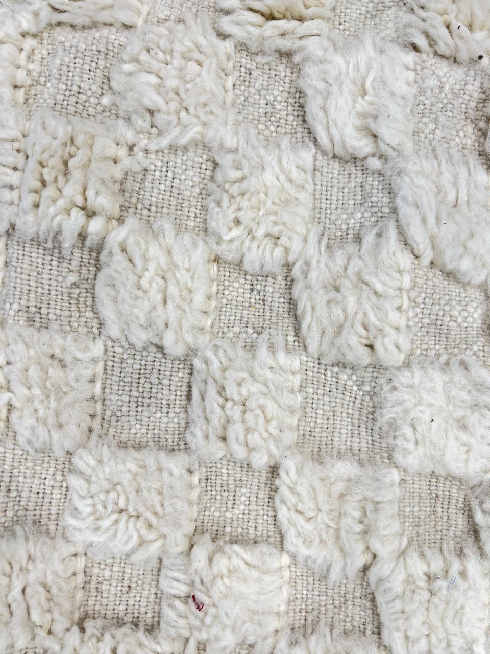 Handmade white Moroccan wool runner rug with subtle checkerboard pattern and fringe edges