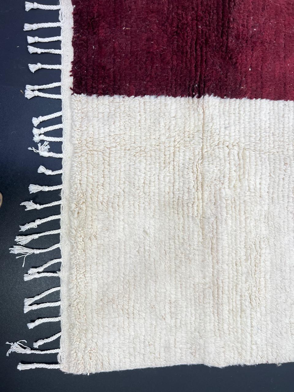 White Moroccan wool rug with burgundy and plum cross pattern, handmade in Morocco