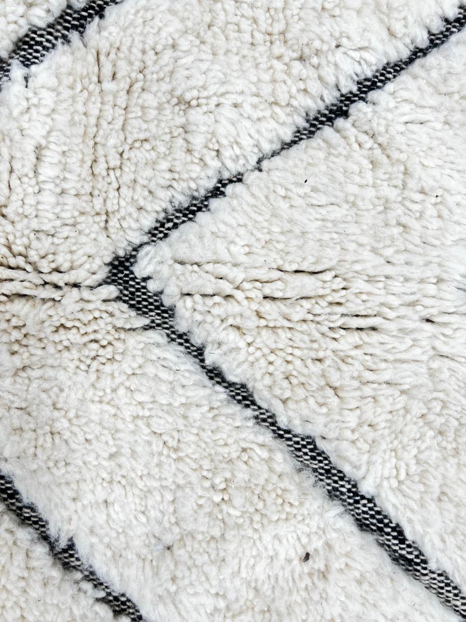 Handmade white Moroccan wool runner rug with charcoal chevron pattern