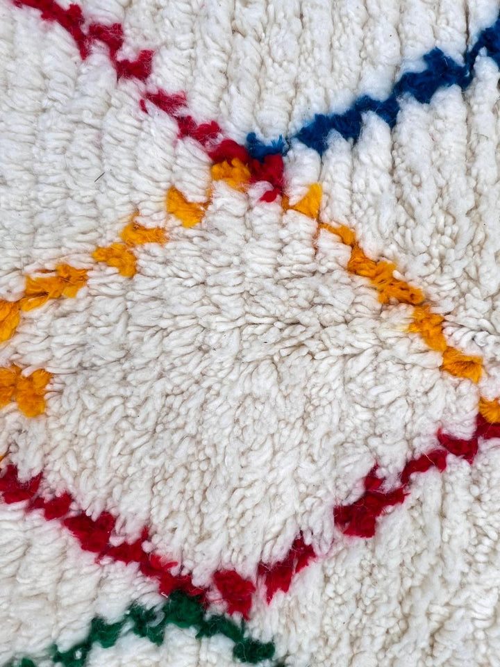 white handmade moroccan berber rug with abstract multicolor line design in wool