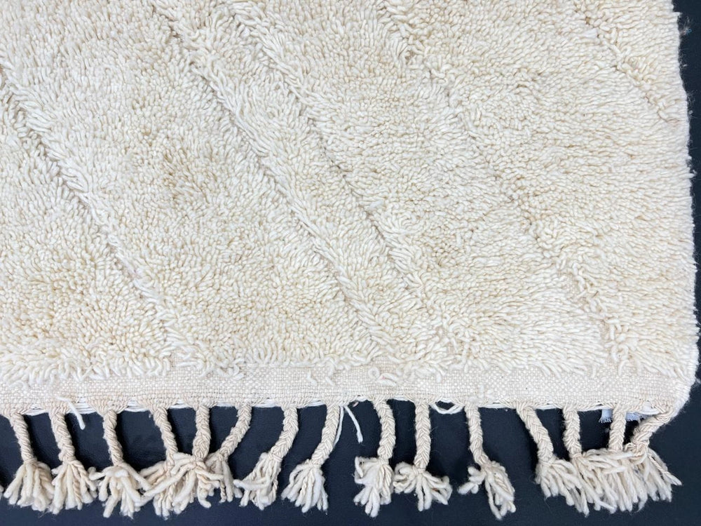 Handmade white Moroccan wool runner rug with minimalist linear carved design