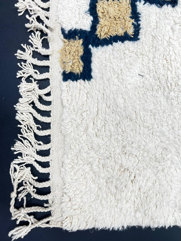 White Moroccan Berber runner rug with black and tan diamond motif, handmade wool hallway carpet with traditional tribal design