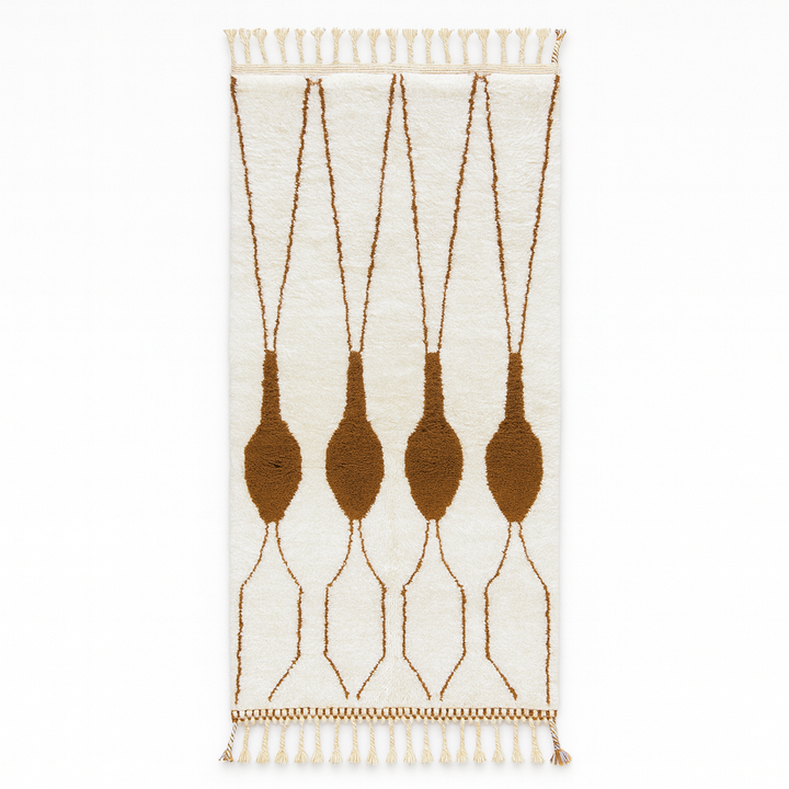 Handmade white Moroccan runner rug with brown abstract elongated motifs, crafted from natural wool by Berber artisans.