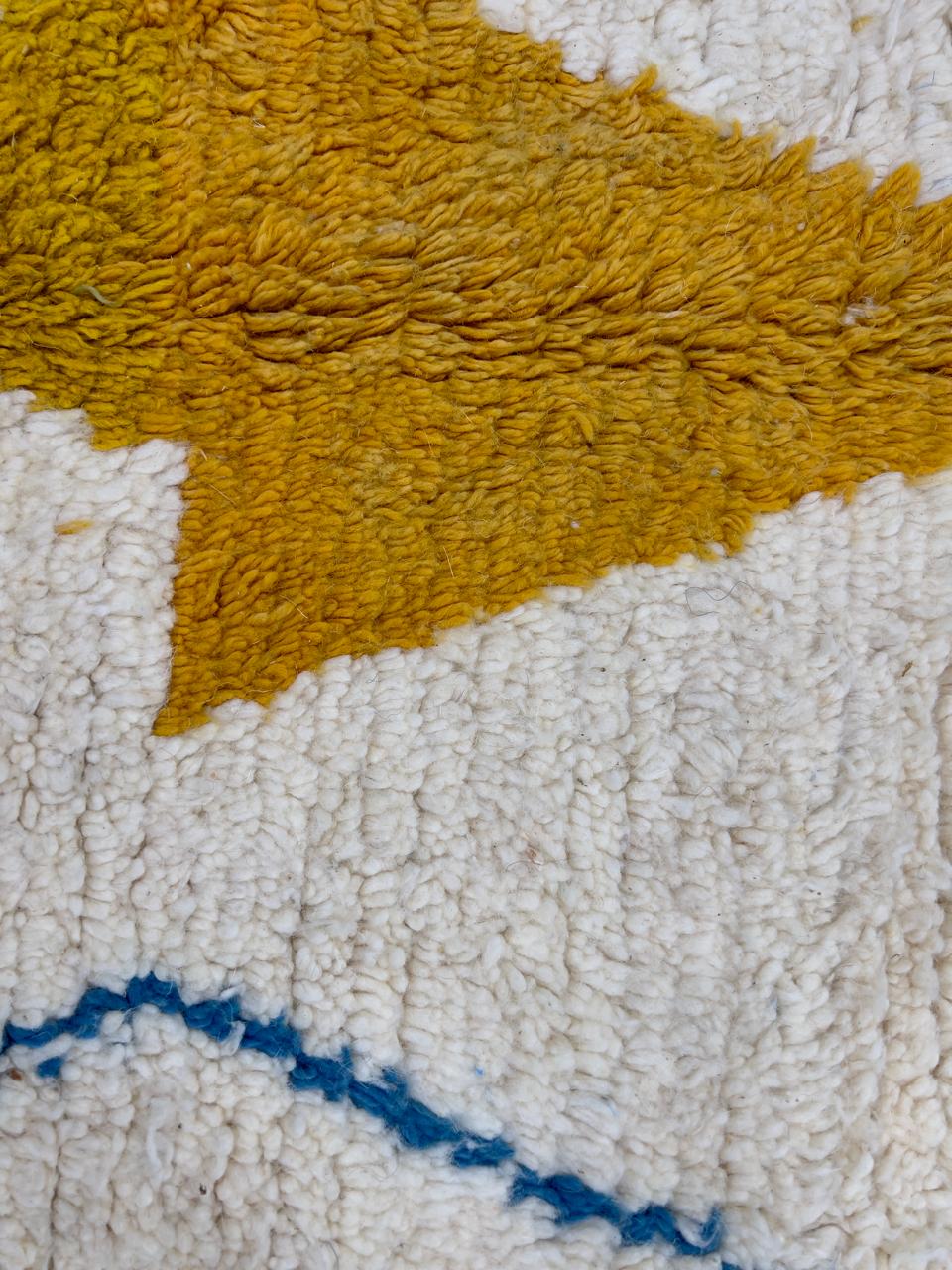 Handmade white Moroccan wool runner rug with multicolor diamond and line motifs