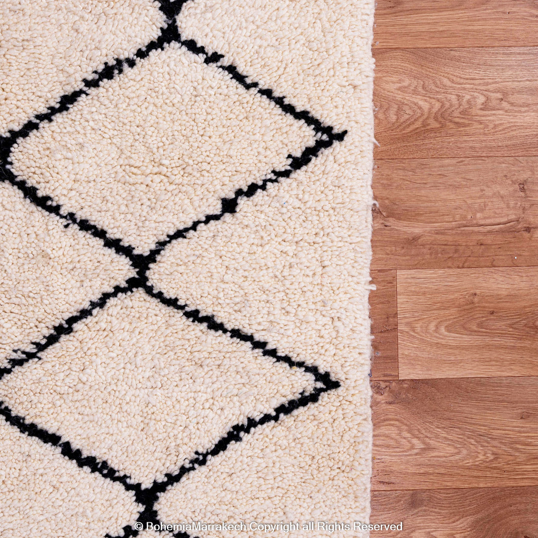 Handwoven Beni Ourain Moroccan rug in black and white wool with geometric diamond pattern