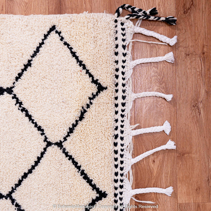 Handwoven Beni Ourain Moroccan rug in black and white wool with geometric diamond pattern