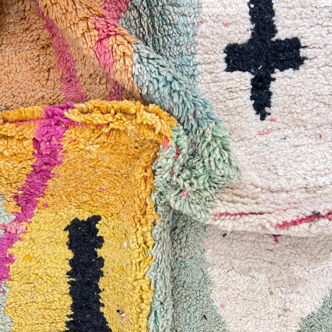 Vintage Moroccan wool rug 857 – handmade abstract Berber carpet in turquoise, black, pink, and mustard tones (290 × 205 cm / 9.51 × 6.72 ft).