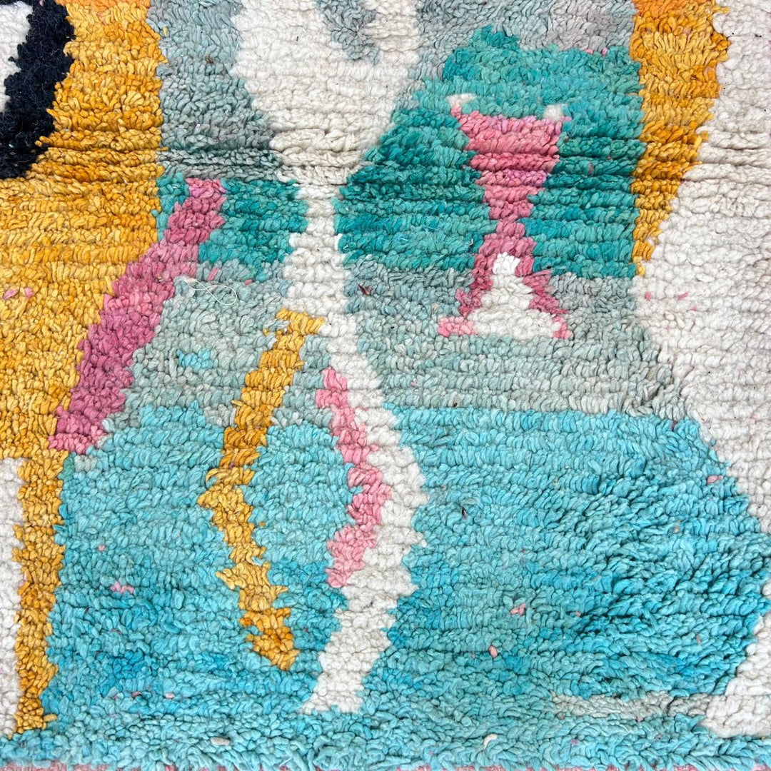 Vintage Moroccan wool rug 857 – handmade abstract Berber carpet in turquoise, black, pink, and mustard tones (290 × 205 cm / 9.51 × 6.72 ft).
