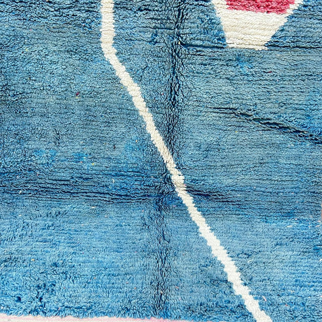 Vintage Moroccan wool rug BM31 – handmade blue, pink, and yellow abstract geometric design (253 × 148 cm).
