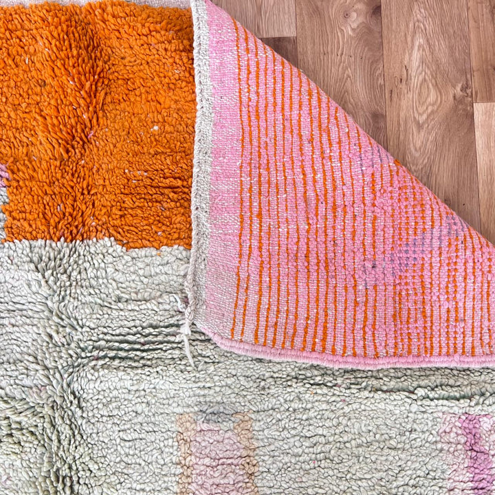Vintage Moroccan wool rug 745 – handmade orange and pink Berber carpet with geometric diamond pattern (251 × 173 cm / 8.23 × 5.67 ft).