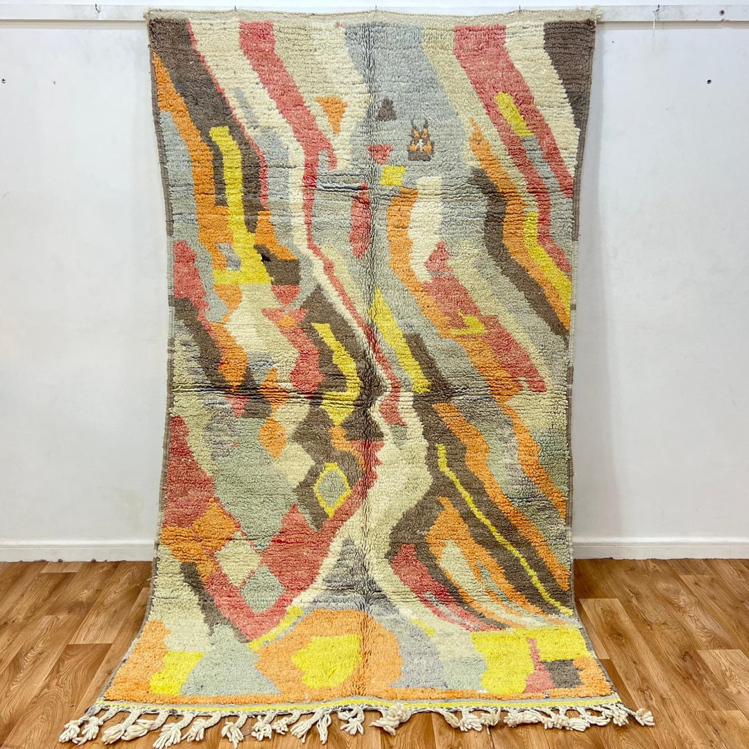 Vintage Moroccan wool rug 396 – handmade abstract earth tone design with yellow, coral, and beige pattern (256 × 148 cm).