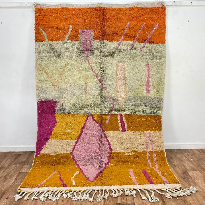 Vintage Moroccan wool rug 745 – handmade orange and pink Berber carpet with geometric diamond pattern (251 × 173 cm / 8.23 × 5.67 ft).