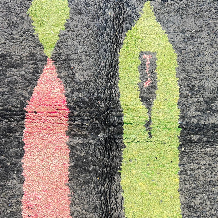 Vintage Moroccan wool rug 731 – handmade Berber carpet with black, green, pink, and grey abstract tribal patterns (233 × 147 cm / 7.64 × 4.82 ft).